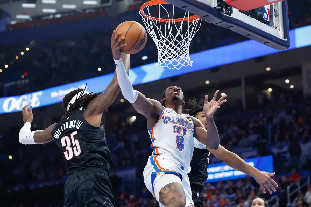 Nov 20, 2024; Oklahoma City, Oklahoma, USA; Oklahoma City Thunder forward Jalen Williams (8) drives to the basket against Portland Trail Blazers center Robert Williams III (35) during the second half at Paycom Center. Mandatory Credit: Alonzo Adams-Imagn Images