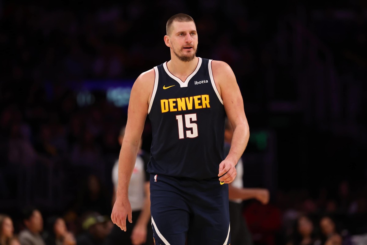 Nov 23, 2024; Los Angeles, California, USA; Denver Nuggets center Nikola Jokic (15) reacts to a play during the third quarter against the Los Angeles Lakers at Crypto.com Arena.