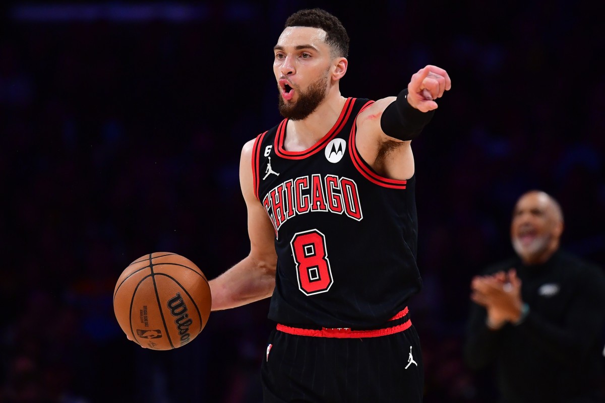 Mar 26, 2023; Los Angeles, California, USA; Chicago Bulls guard Zach LaVine (8) controls the ball against the Los Angeles Lakers during the second half at Crypto.com Arena. Mandatory Credit: Gary A. Vasquez-Imagn Images