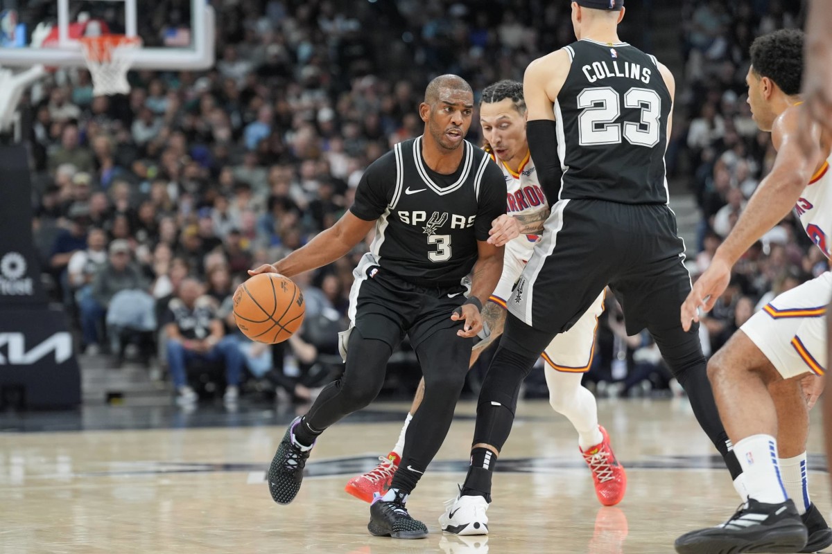 Nov 23, 2024; San Antonio, Texas, USA; San Antonio Spurs guard Chris Paul (3) goes around a screen from forward Zach Collins (23) in the first half against the Golden State Warriors at Frost Bank Center. Mandatory Credit: Daniel Dunn-Imagn Images  