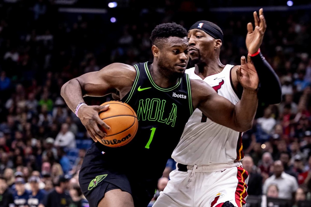 Feb 23, 2024; New Orleans, Louisiana, USA; New Orleans Pelicans forward Zion Williamson (1) drives to the basket against Miami Heat center Bam Adebayo (13) during the second half at Smoothie King Center. Mandatory Credit: Stephen Lew-Imagn Images 