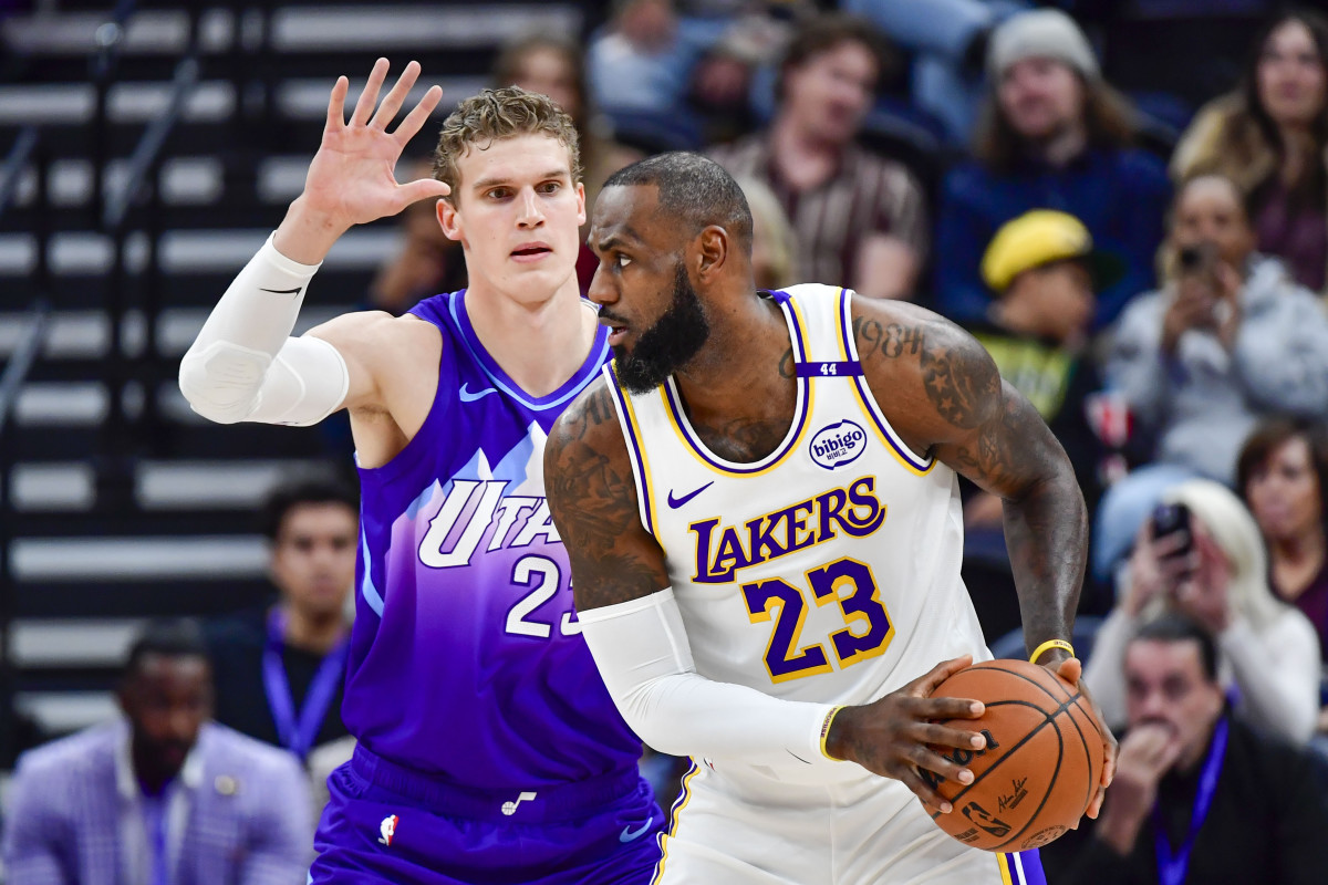 Dec 1, 2024; Salt Lake City, Utah, USA; Utah Jazz forward/center Lauri Markkanen (23) defends Los Angeles Lakers forward LeBron James (23) during the first half at the Delta Center. Mandatory Credit: Christopher Creveling-Imagn Images  