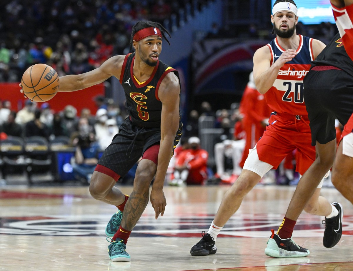 Dec 30, 2021; Washington, District of Columbia, USA; Cleveland Cavaliers guard RJ Nembhard Jr. (5) dribbles as Washington Wizards forward Jordan Schakel (20) looks on during the first half at Capital One Arena