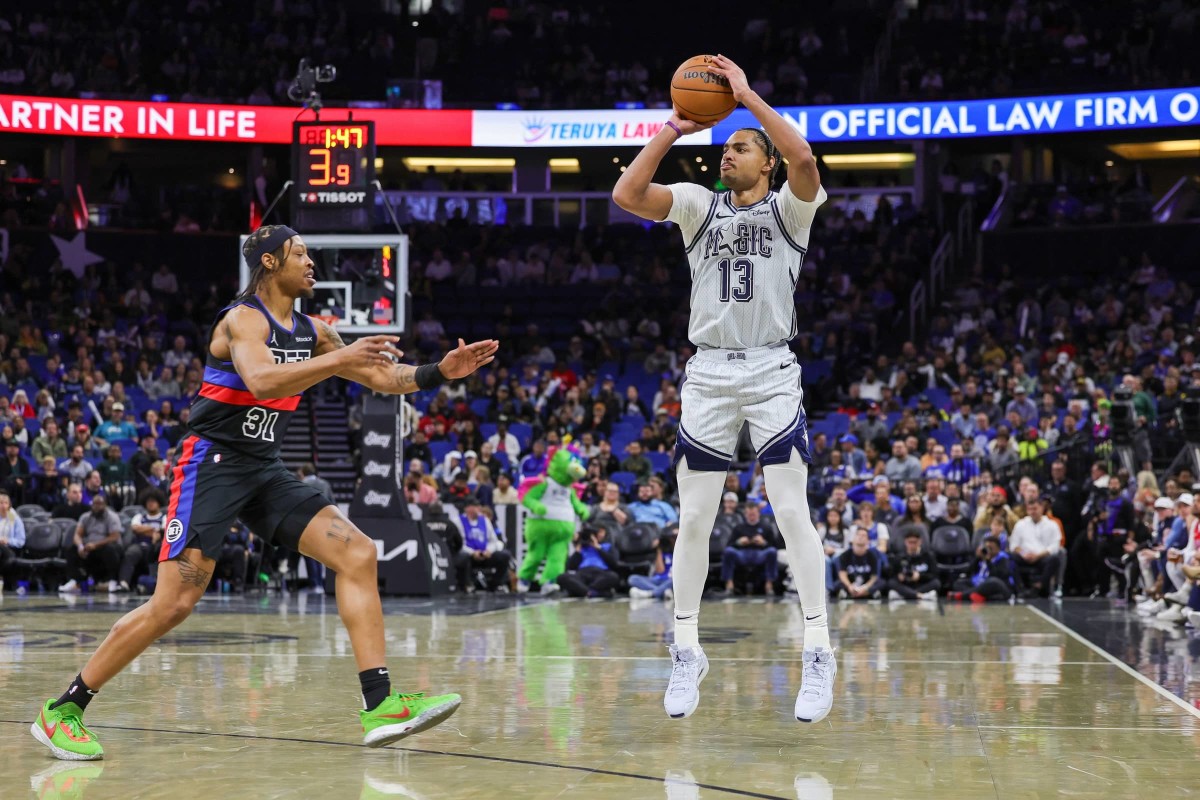 Nov 23, 2024; Orlando, Florida, USA; Orlando Magic guard Jett Howard (13) shoots against Detroit Pistons guard Alondes Williams (31) during the second half at Kia Center. Mandatory Credit: Mike Watters-Imagn Images  