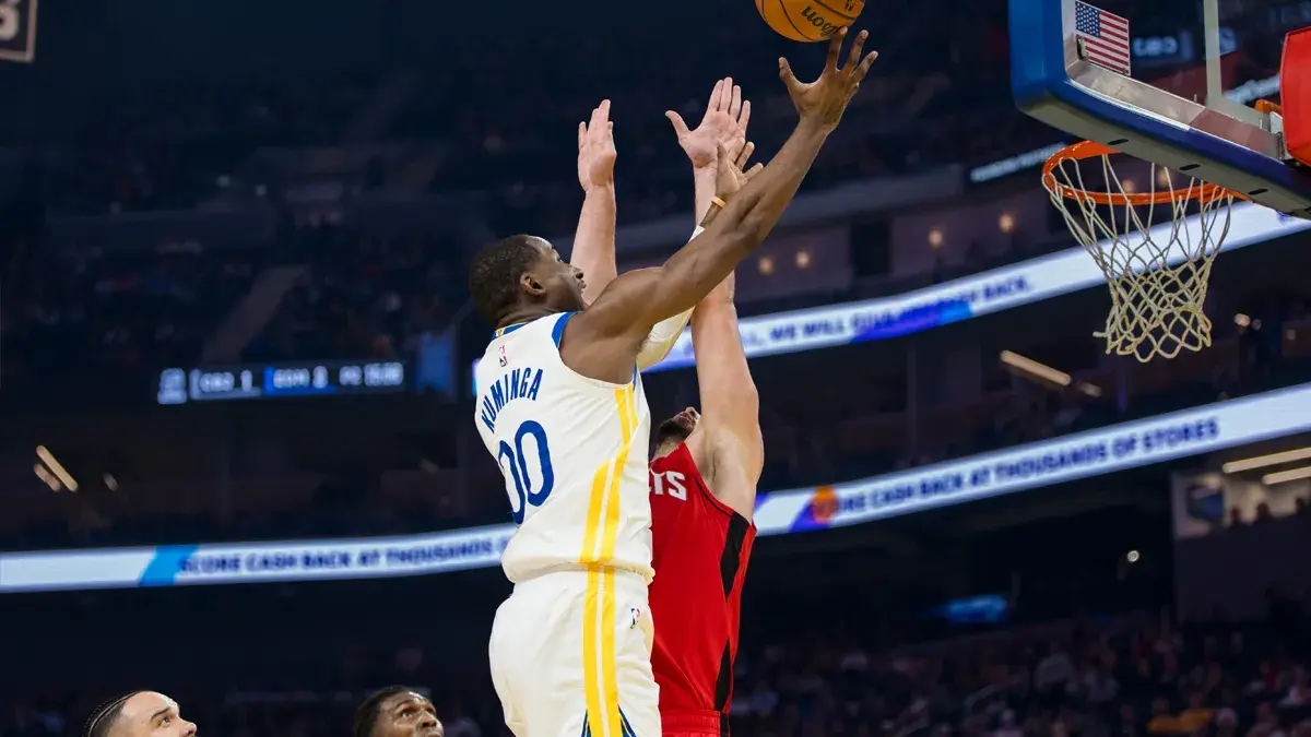 Golden State Warriors forward Jonathan Kuminga (00) shoots over Houston Rockets center Alperen Sengun (28) during the first quarter at Chase Center. Mandatory Credit: John Hefti-Imagn Images