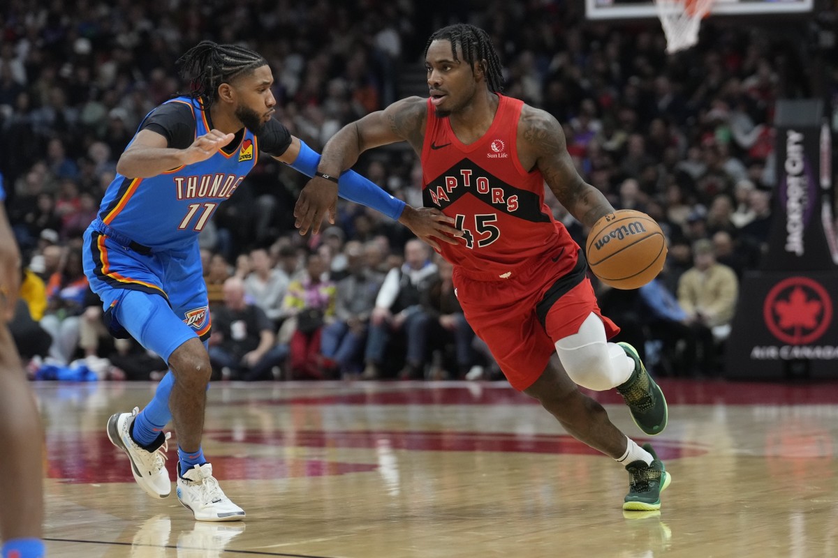 Dec 5, 2024; Toronto, Ontario, CAN; Toronto Raptors guard Davion Mitchell (45) and Oklahoma City Thunder guard Isaiah Joe (11) during the first half at Scotiabank Arena