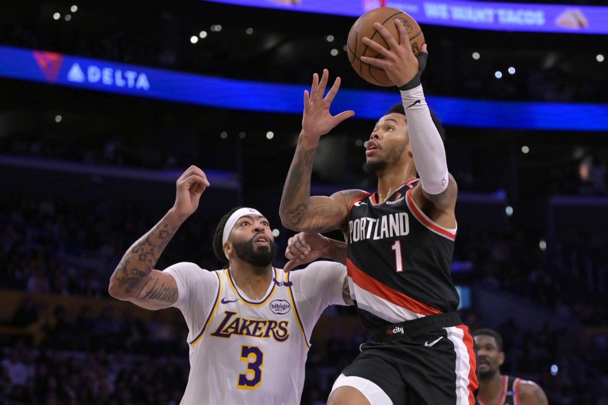 Portland Trail Blazers guard Anfernee Simons (1) drives past Los Angeles Lakers forward Anthony Davis (3) in the first half at Crypto.com Arena. Mandatory Credit: Jayne Kamin-Oncea-Imagn Images