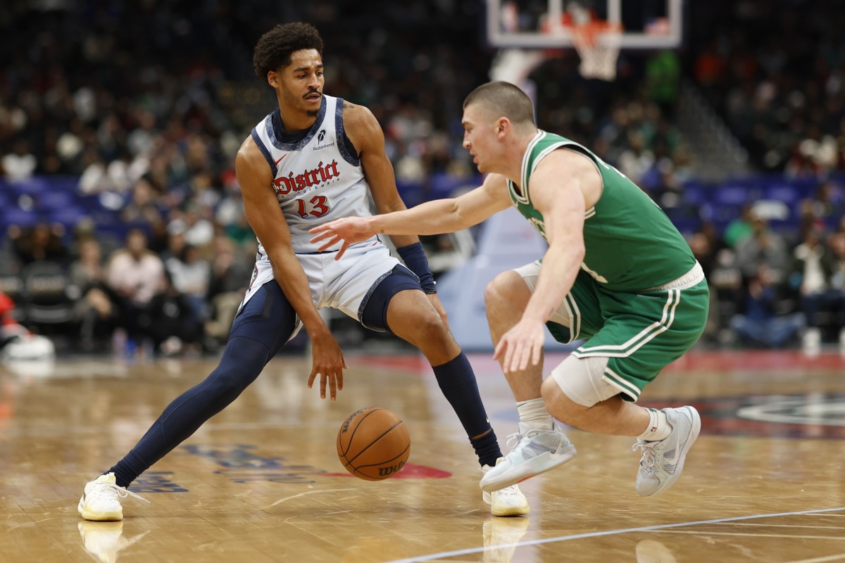 District of Columbia, USA; Washington Wizards guard Jordan Poole (13) dribbles the ball as Boston Celtics guard Payton Pritchard (11) loses his balance defending in the third quarter at Capital One Arena. Mandatory Credit: Geoff Burke-Imagn Images