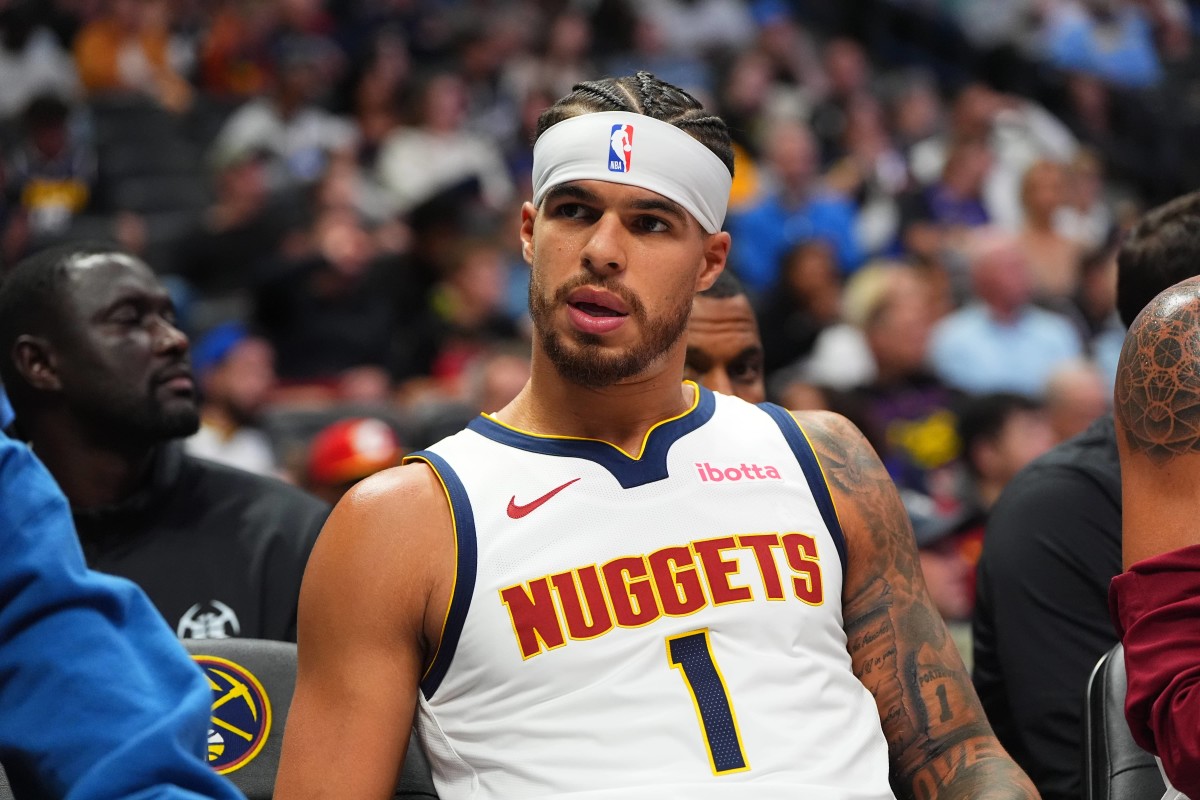 Denver, Colorado, USA; Denver Nuggets forward Michael Porter Jr. (1) on the bench in the second half against the Oklahoma City Thunder at Ball Arena. Mandatory Credit: Ron Chenoy-Imagn Images