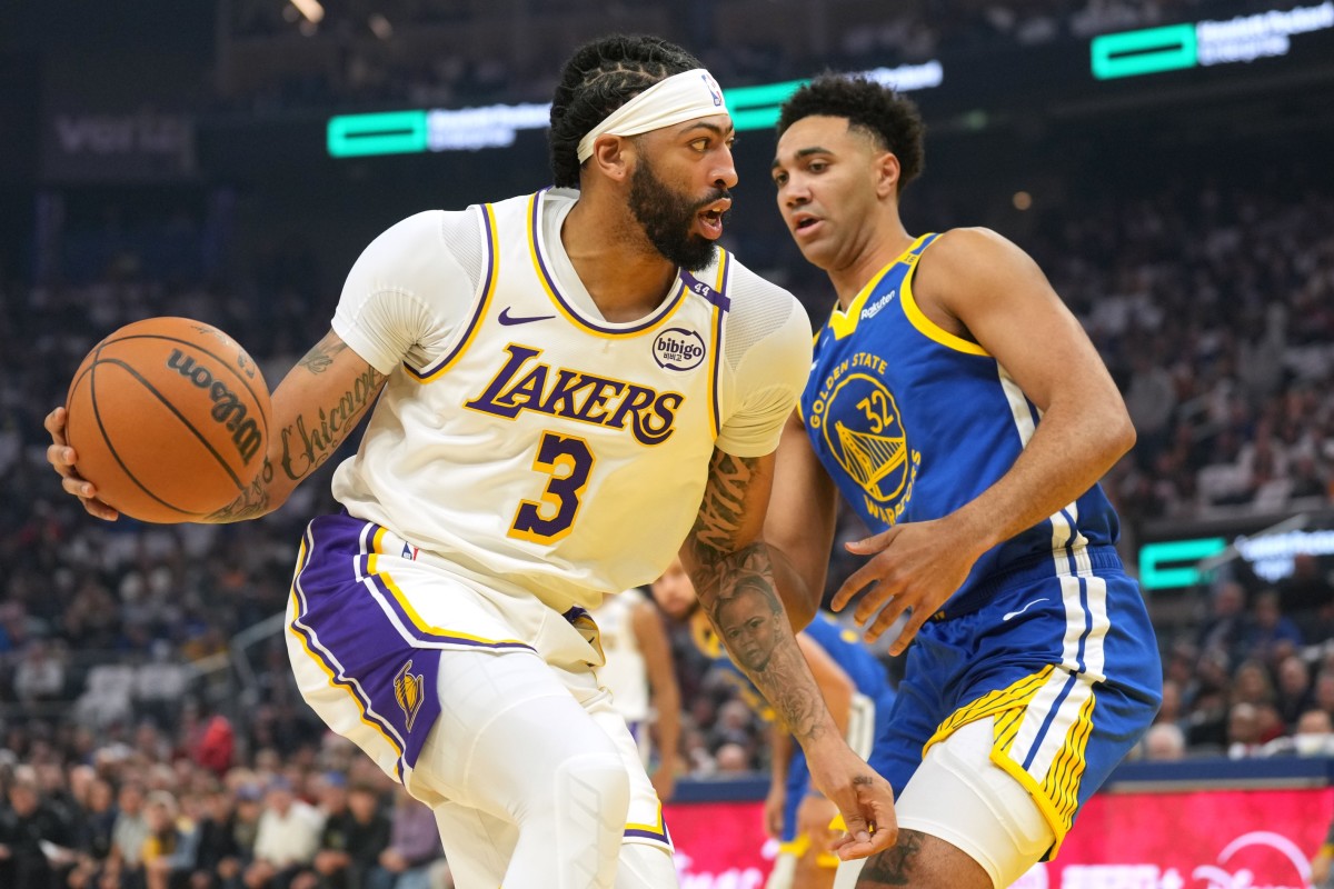  Los Angeles Lakers forward Anthony Davis (3) dribbles against Golden State Warriors forward Trayce Jackson-Davis (32) during the first quarter at Chase Center. Mandatory Credit: Darren Yamashita-Imagn Images