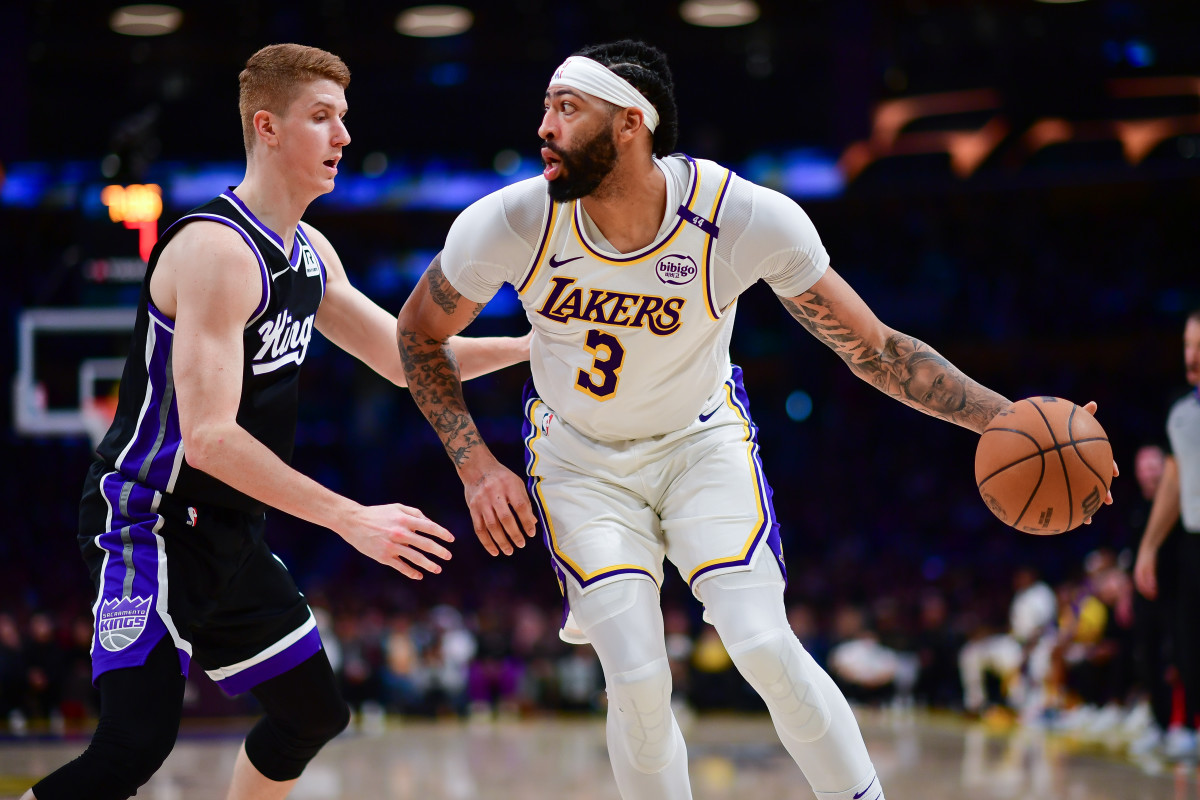 Dec 28, 2024; Los Angeles, California, USA; Los Angeles Lakers forward Anthony Davis (3) moves the ball against Sacramento Kings guard Kevin Huerter (9) during the second half at Crypto.com Arena. Mandatory Credit: Gary A. Vasquez-Imagn Images  