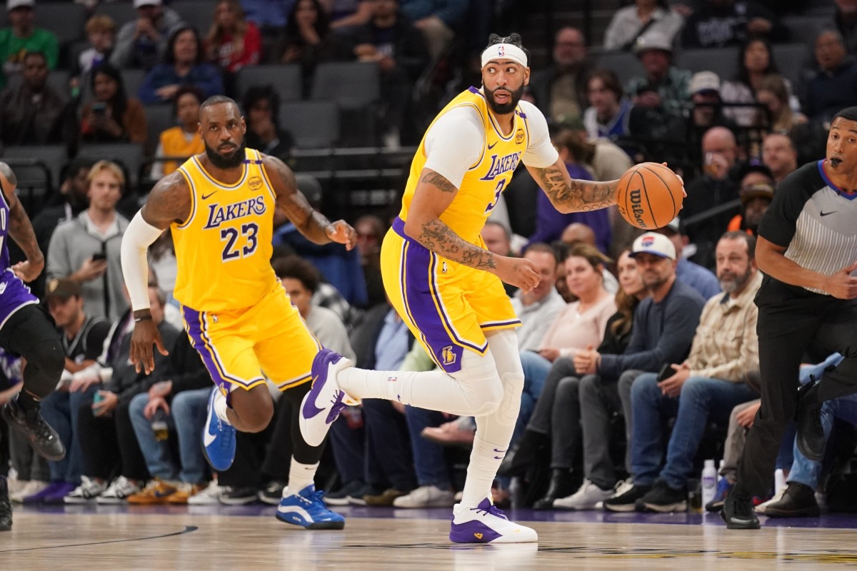 Los Angeles Lakers forward Anthony Davis (3) dribbles the ball next to forward LeBron James (23) against the Sacramento Kings in the first quarter at the Golden 1 Center. Mandatory Credit: Cary Edmondson-Imagn Images