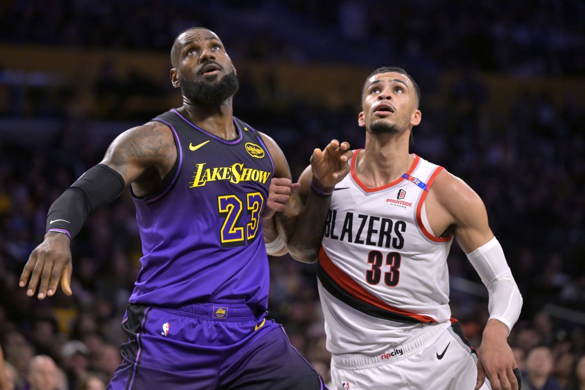 Los Angeles Lakers forward LeBron James (23) boxes out Portland Trail Blazers forward Toumani Camara (33) in the first half at Crypto.com Arena. Mandatory Credit: Jayne Kamin-Oncea-Imagn Images