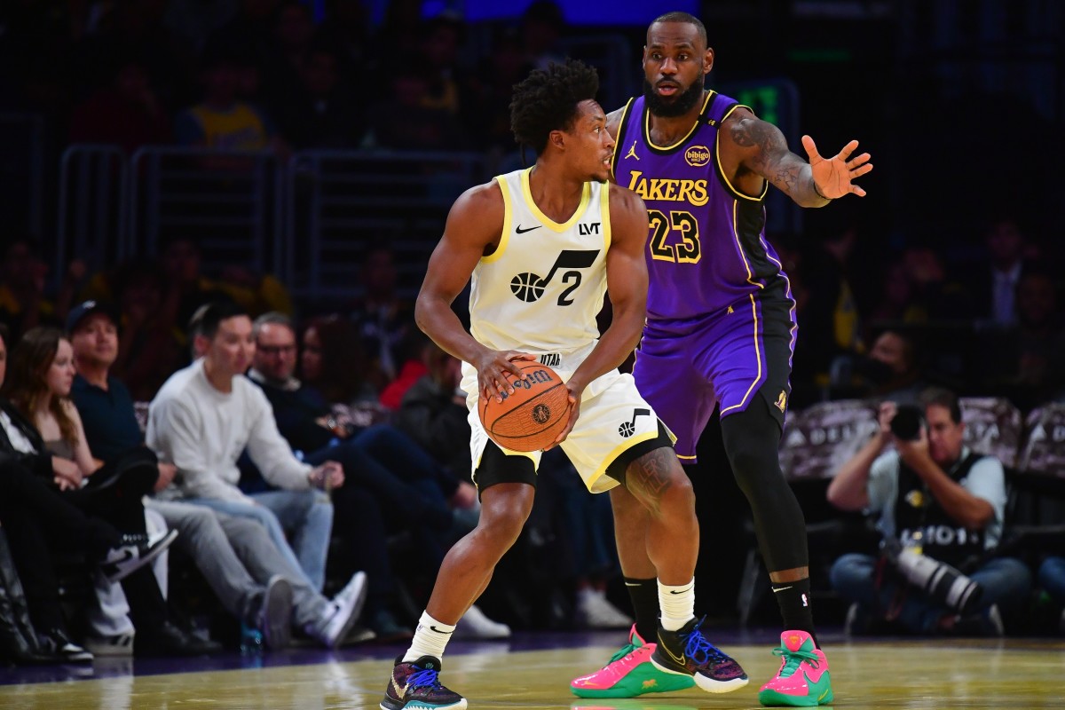 Utah Jazz guard Collin Sexton (2) moves the ball against Los Angeles Lakers forward LeBron James (23) during the first half at Crypto.com Arena. Mandatory Credit: Gary A. Vasquez-Imagn Images