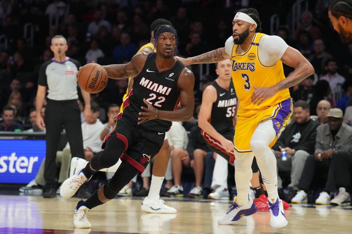 Miami Heat forward Jimmy Butler (22) drives past Los Angeles Lakers forward Anthony Davis (3) in the first half at Kaseya Center. Mandatory Credit: Jim Rassol-Imagn Images