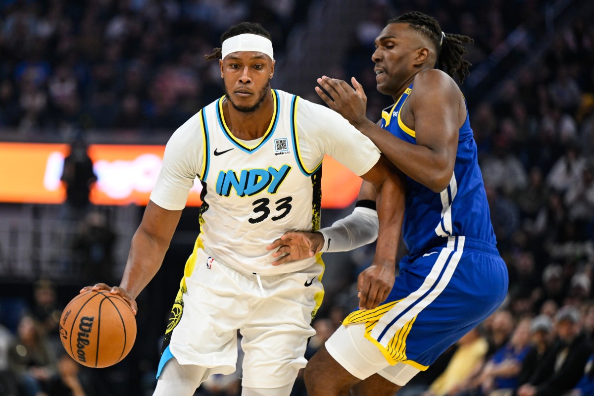 Indiana Pacers center Myles Turner (33) dribbles against Golden State Warriors forward Kevon Looney (5) in the first quarter at Chase Center. Mandatory Credit: Eakin Howard-Imagn Images