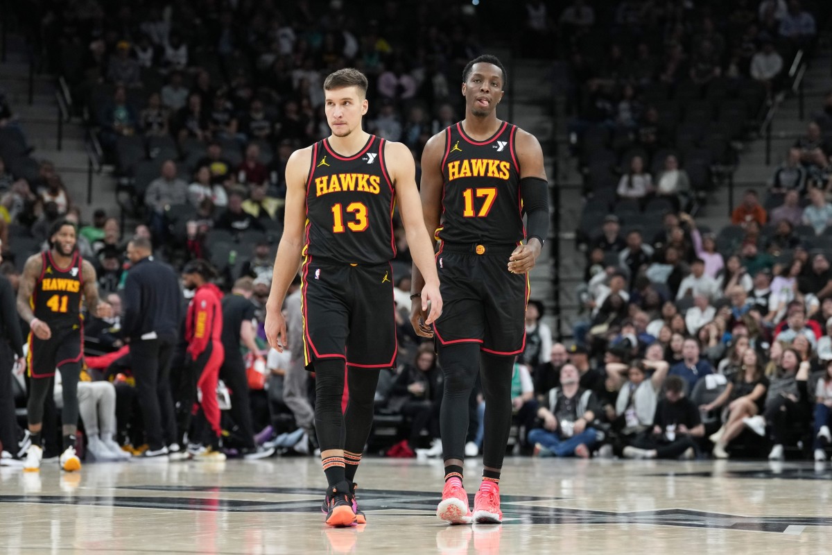 Atlanta Hawks guard Bogdan Bogdanovic (13) and forward Onyeka Okongwu (17) walk up the court in the second half against the San Antonio Spurs at the Frost Bank Center. Mandatory Credit: Daniel Dunn-Imagn Images