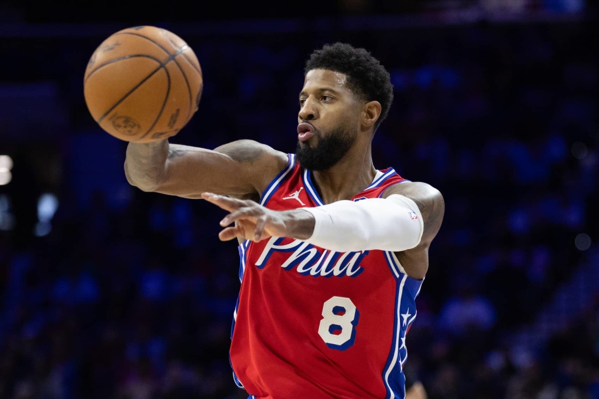 Philadelphia 76ers forward Paul George (8) passes the ball against the Cleveland Cavaliers during the second quarter at Wells Fargo Center.