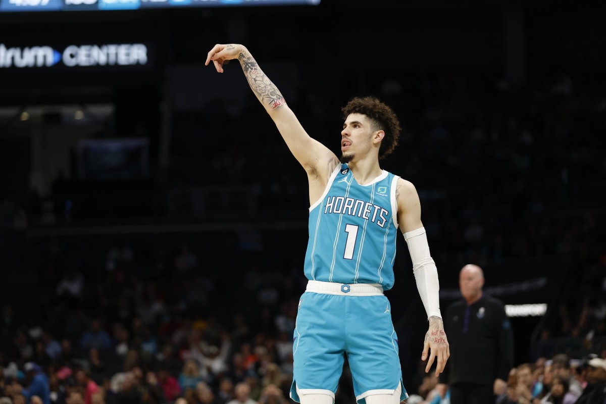 Feb 15, 2023; Charlotte, North Carolina, USA; Charlotte Hornets guard LaMelo Ball (1) watches his 3-point shot against the San Antonio Spurs during the second half at Spectrum Center. The Charlotte Hornets won 120-110. Mandatory Credit: Nell Redmond-Imagn Images