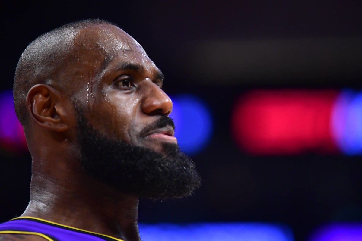 Feb 6, 2025; Los Angeles, California, USA; Los Angeles Lakers forward LeBron James (23) reacts during the first half at Crypto.com Arena. Mandatory Credit: Gary A. Vasquez-Imagn Images