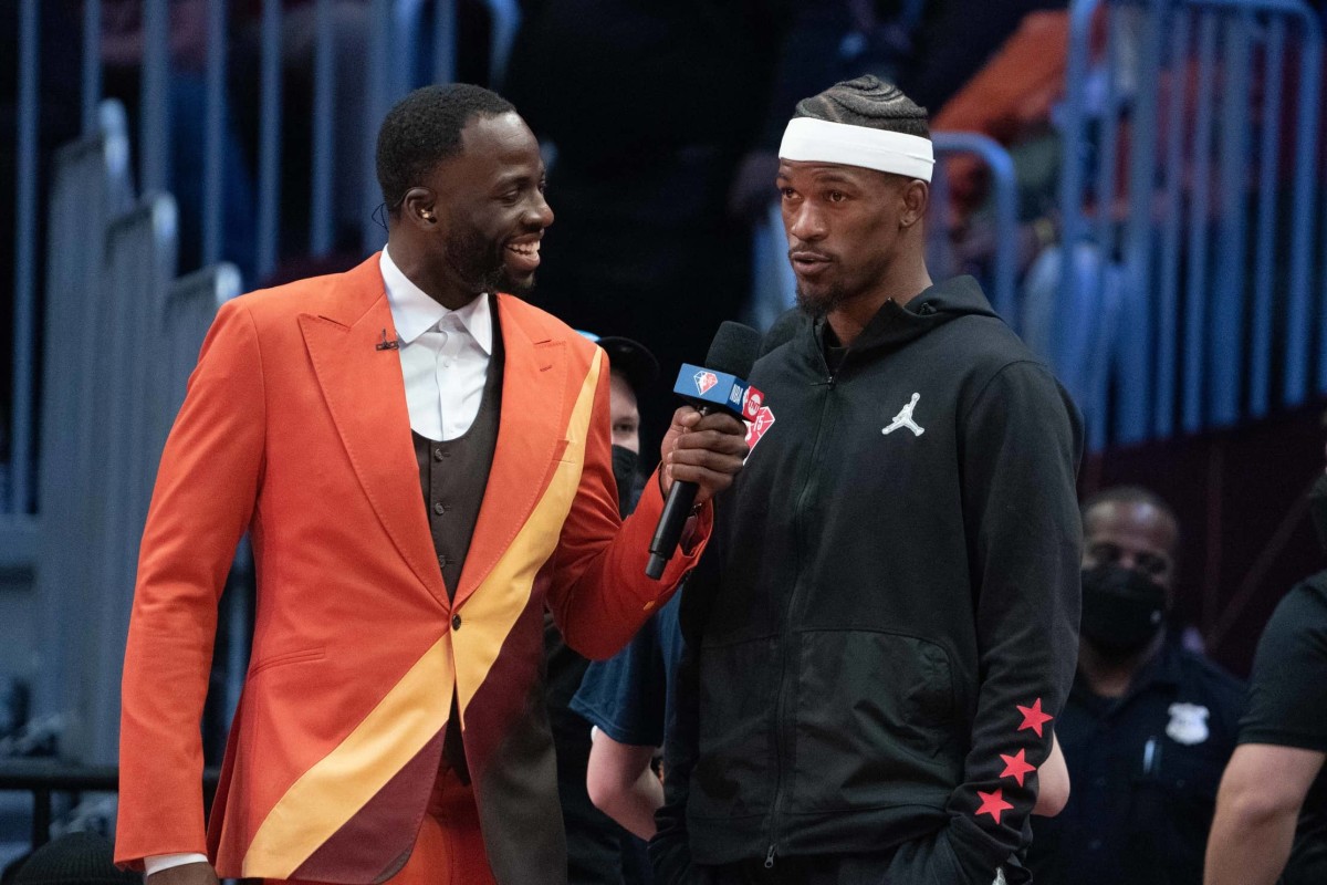 February 20, 2022; Cleveland, Ohio, USA; Team Durant forward Draymond Green of the Golden State Warriors (23, left) interviews Team LeBron forward Jimmy Butler of the Miami Heat (22) during the fourth quarter in the 2022 NBA All-Star Game at Rocket Mortgage FieldHouse. Mandatory Credit: Kyle Terada-Imagn Images