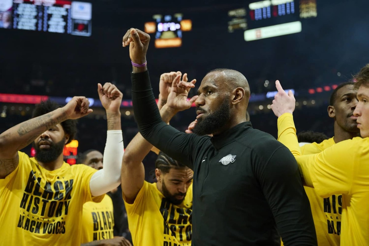 Feb 20, 2025; Portland, Oregon, USA; Los Angeles Lakers forward LeBron James (23) brings teammates together into a huddle during introductions before a game against the Portland Trail Blazers at Moda Center. Mandatory Credit: Troy Wayrynen-Imagn Images