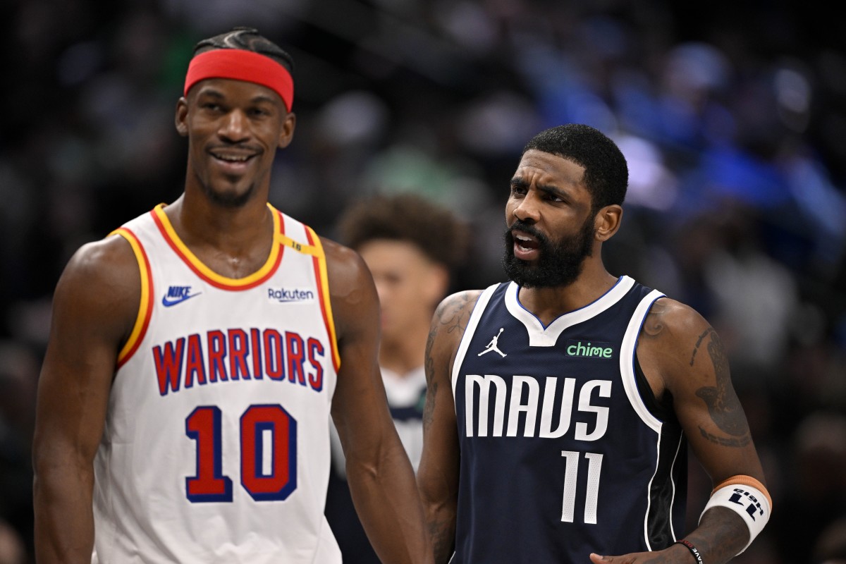 Golden State Warriors forward Jimmy Butler (10) laughs as Dallas Mavericks guard Kyrie Irving (11) argues a call during the second half at the American Airlines Center. Mandatory Credit: Jerome Miron-Imagn Images