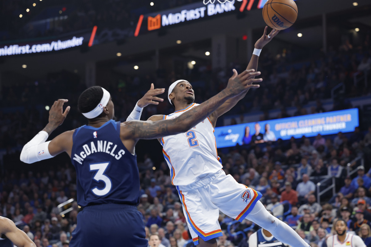 Feb 24, 2025; Oklahoma City, Oklahoma, USA; Oklahoma City Thunder guard Shai Gilgeous-Alexander (2) shoots as Minnesota Timberwolves forward Jaden McDaniels (3) defends during the second quarter at Paycom Center. Mandatory Credit: Alonzo Adams-Imagn Images  