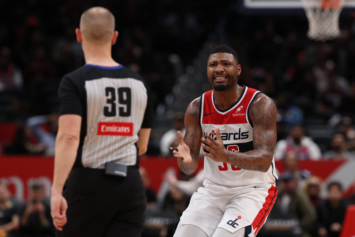 Feb 26, 2025; Washington, District of Columbia, USA; Washington Wizards guard Marcus Smart (36) reacts after being whistled for a technical foul by referee Tyler Ford (39) against the Portland Trail Blazers late in the second half at Capital One Arena. Mandatory Credit: Geoff Burke-Imagn Images