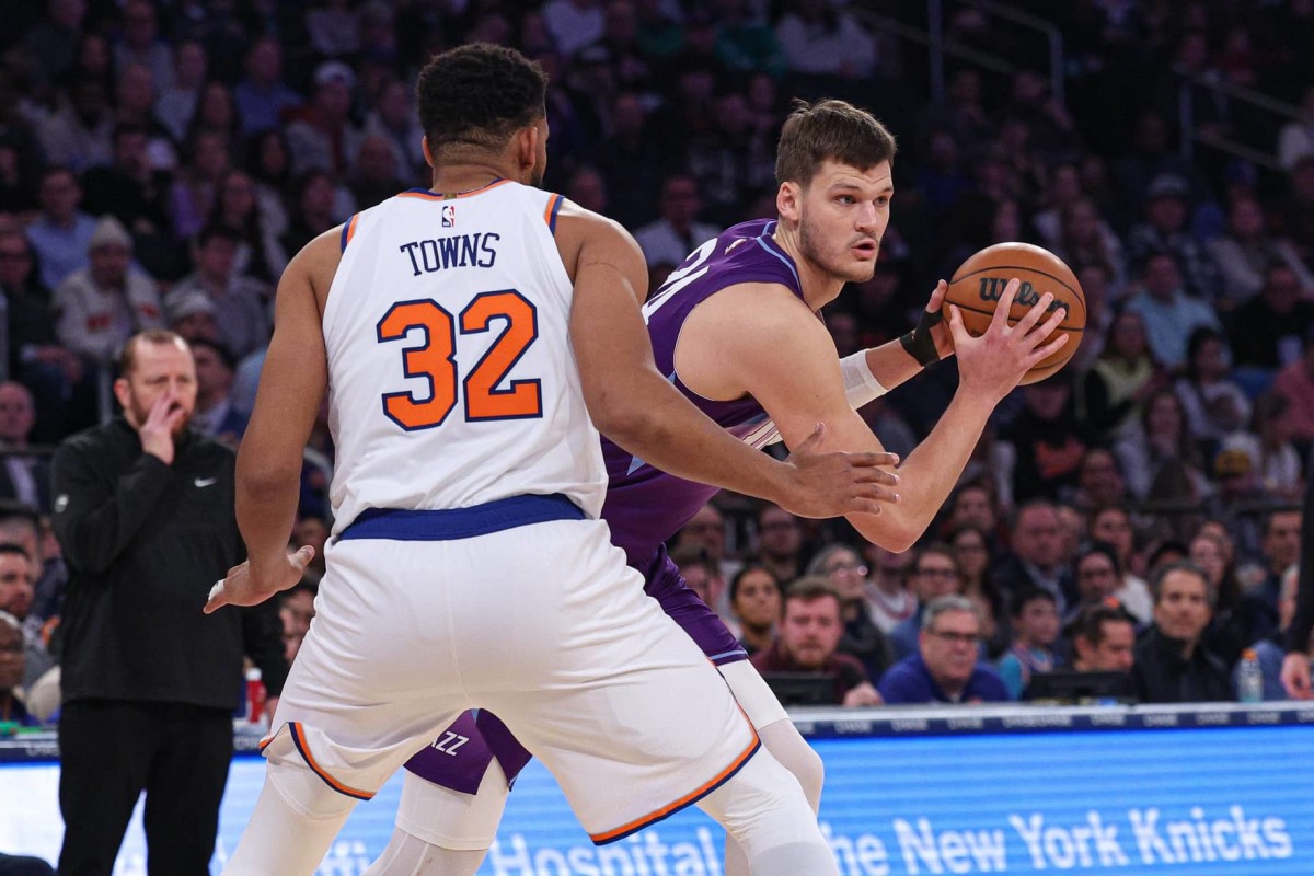 Jan 1, 2025; New York, New York, USA; Utah Jazz center Walker Kessler (24) shields the ball from New York Knicks center Karl-Anthony Towns (32) during the first half at Madison Square Garden. Mandatory Credit- Vincent Carchietta-Imagn Images