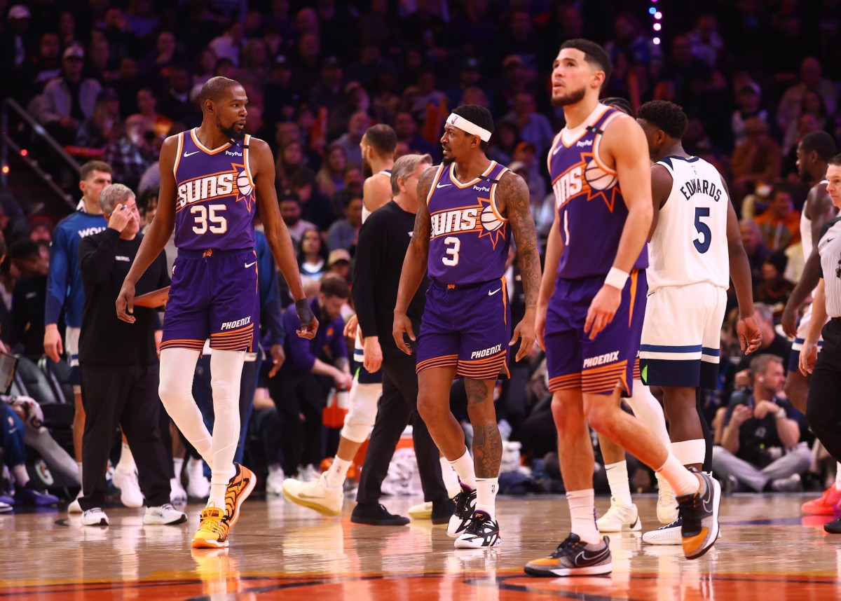Phoenix Suns forward Kevin Durant (35) with guard Bradley Beal (3) and Devin Booker (1) against the Minnesota Timberwolves at Footprint Center. Mandatory Credit: Mark J. Rebilas-Imagn Images