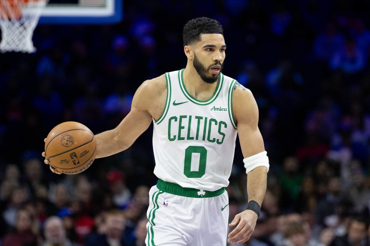 Philadelphia, Pennsylvania, USA; Boston Celtics forward Jayson Tatum (0) dribbles the ball against the Philadelphia 76ers during the first quarter at Wells Fargo Center. Mandatory Credit: Bill Streicher-Imagn Images