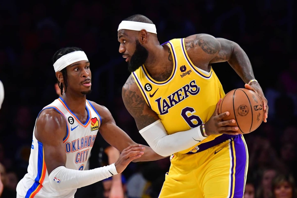 Oklahoma City Thunder guard Shai Gilgeous-Alexander (2) defends against Los Angeles Lakers forward LeBron James (6) in the second quarter at Crypto.com Arena.