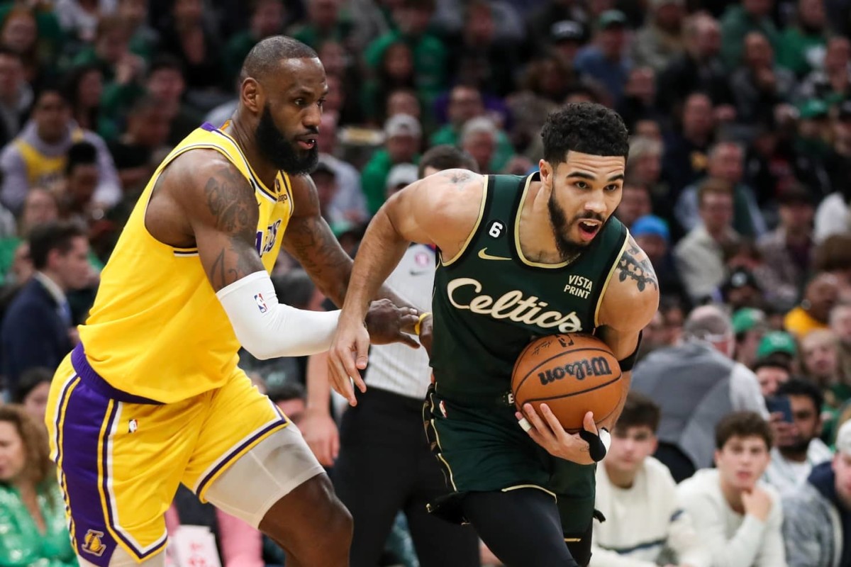 Boston Celtics forward Jayson Tatum (0) defended by Los Angeles Lakers forward LeBron James (6) during the first half at TD Garden.