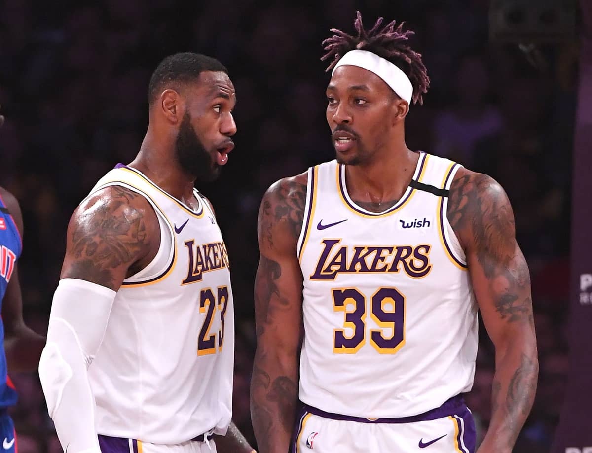 Los Angeles Lakers forward LeBron James (23) talks with center Dwight Howard (39) after a pass resulted in a basket and foul in the first half against the Detroit Pistons at Staples Center.