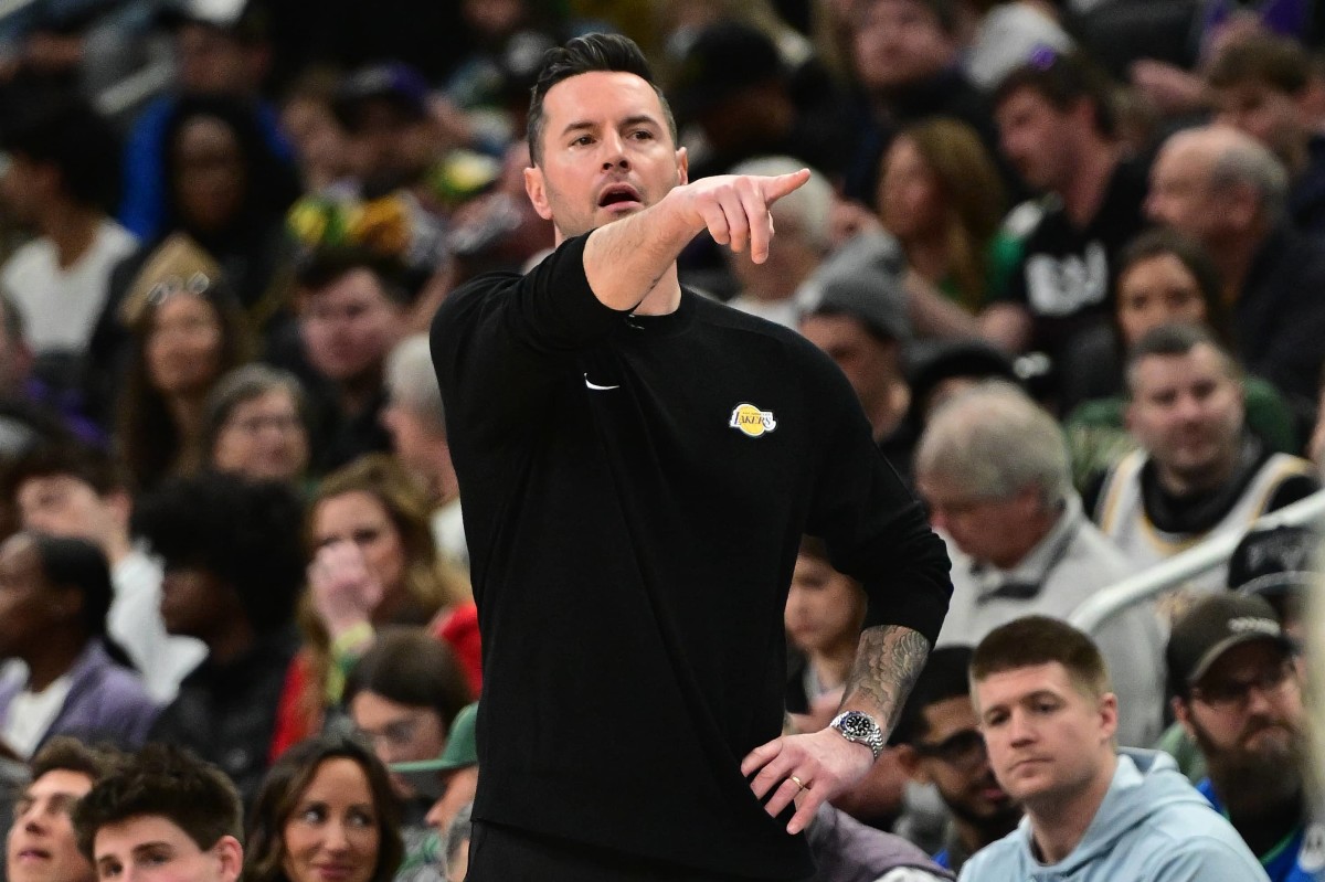 Milwaukee, Wisconsin, USA; Los Angeles Lakers head coach JJ Redick calls a play in the third quarter against the Milwaukee Bucks at Fiserv Forum. Mandatory Credit: Benny Sieu-Imagn Images