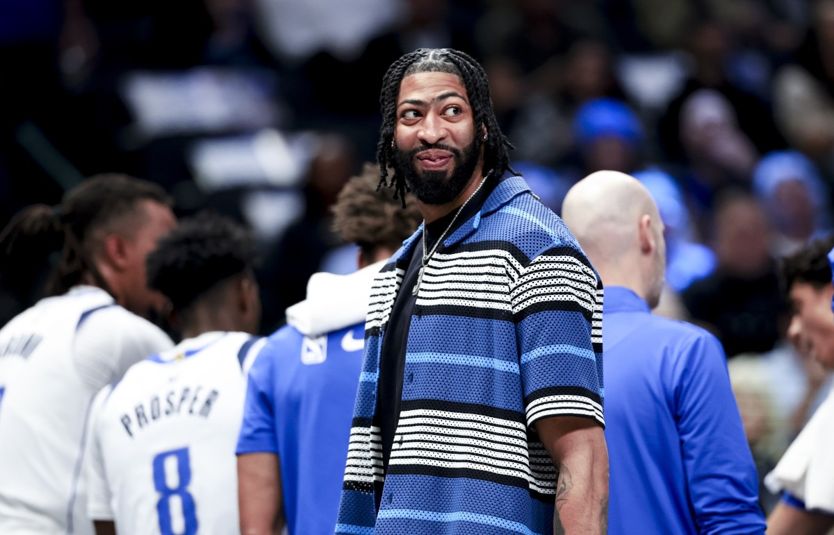 Dallas Mavericks forward Anthony Davis laughs during a timeout against the Charlotte Hornets during the first half at American Airlines Center. Mandatory Credit: Kevin Jairaj-Imagn Images