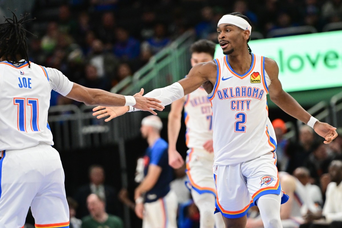 Oklahoma City Thunder guard Shai Gilgeous-Alexander (2) celebrates with guard Isaiah Joe (11) after score in the fourth quarter against the Milwaukee Bucks at Fiserv Forum. Mandatory Credit: Benny Sieu-Imagn Images