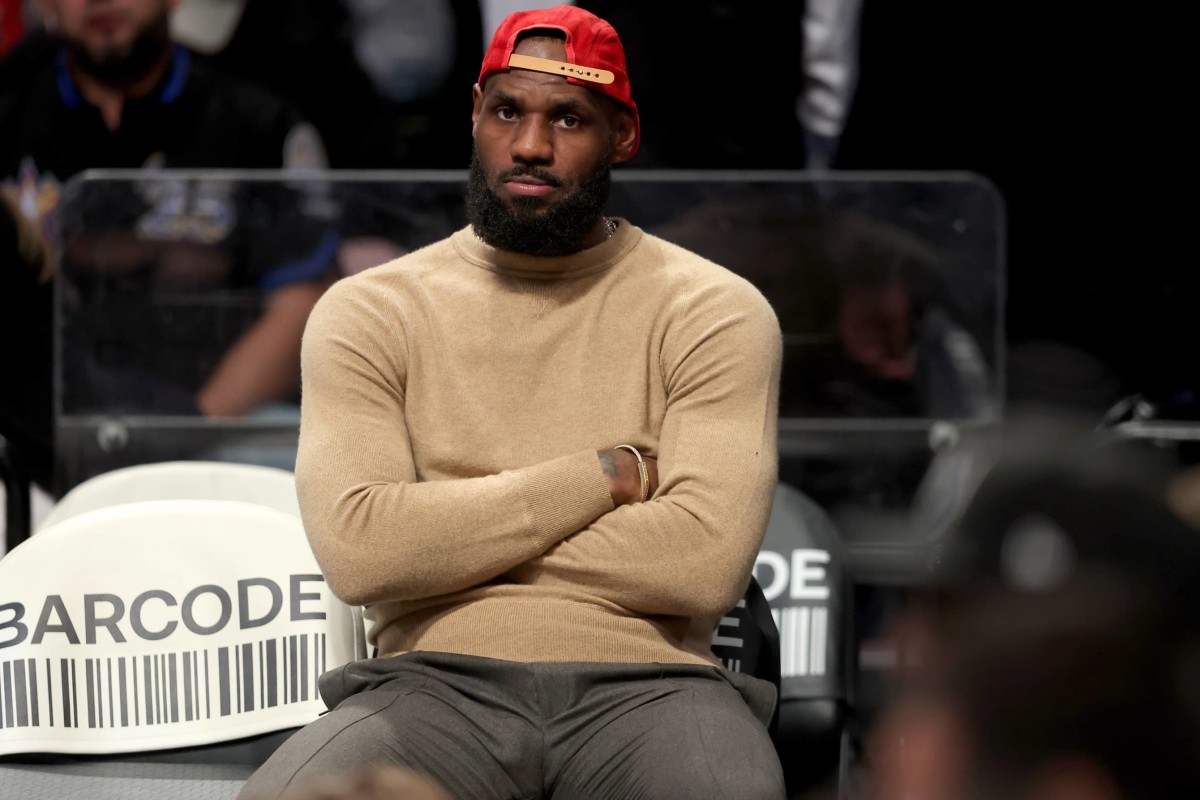 Los Angeles Lakers forward LeBron James (23) watches from the bench during the fourth quarter against the Brooklyn Nets at Barclays Center.