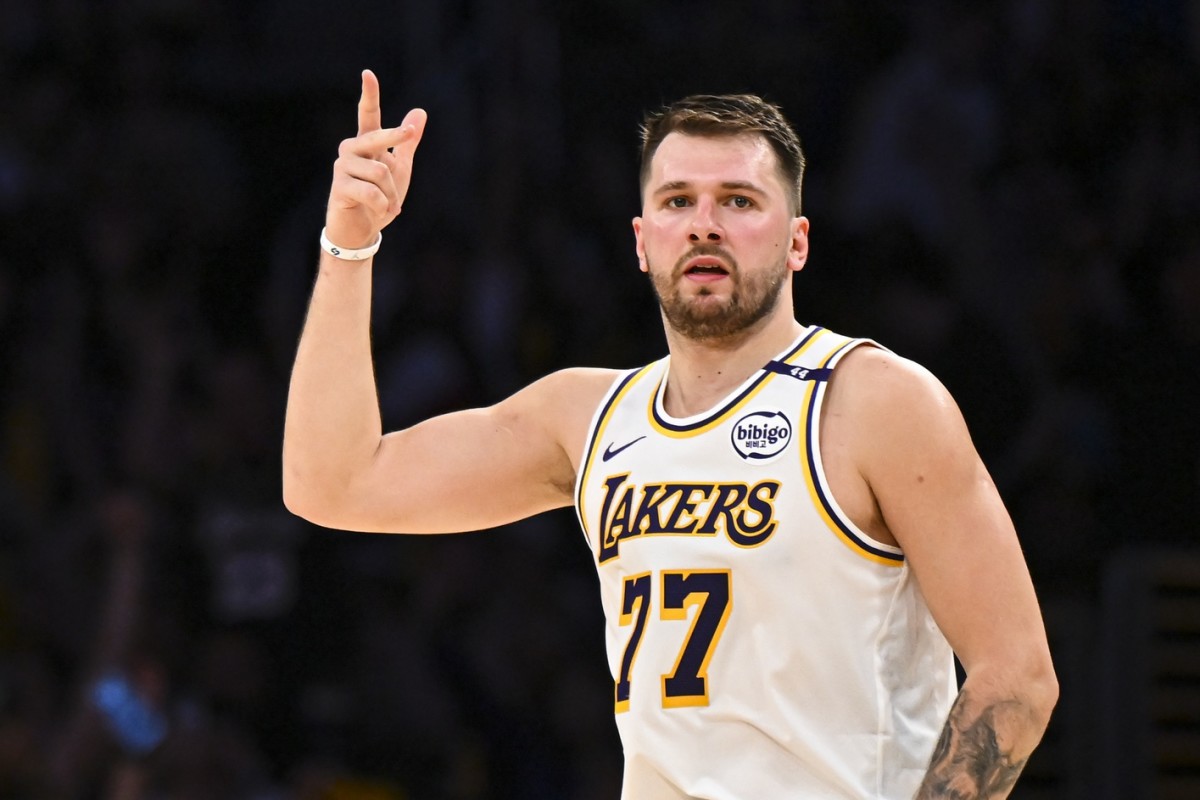 Los Angeles Lakers guard Luka Doncic (77) reacts after scoring against Chicago Bulls during the first half at Crypto.com Arena. Mandatory Credit: Jonathan Hui-Imagn Images
