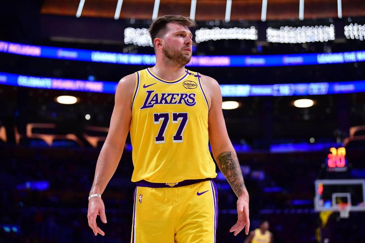 Los Angeles, California, USA; Los Angeles Lakers guard Luka Doncic (77) reacts during the first half at Crypto.com Arena. Mandatory Credit: Gary A. Vasquez-Imagn Images