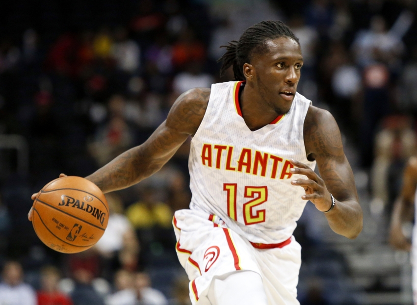 Oct 13, 2016; Atlanta, GA, USA; Atlanta Hawks forward Taurean Prince (12) drives to the basket against the Detroit Pistons in the fourth quarter at Philips Arena. The Pistons defeated the Hawks 99-94. Mandatory Credit: Brett Davis-USA TODAY Sports
