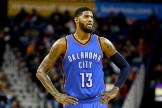 Paul George looks on during a Thunder game.
