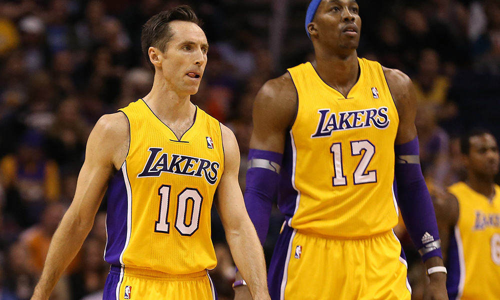 Jan. 30, 2013; Phoenix, AZ, USA: Los Angeles Lakers guard Steve Nash (10) and center Dwight Howard (12) against the Phoenix Suns at the US Airways Center. Mandatory Credit: Mark J. Rebilas-USA TODAY Sports