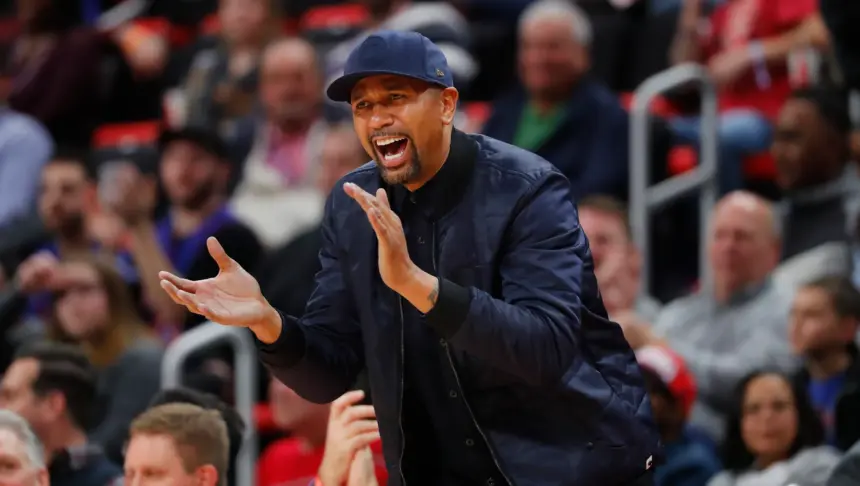 Former NBA player and Detroit native, Jalen Rose, cheers on the Detroit Pistons from his court side seat during their game against the Houston Rockets in the second quarter at Little Caesars Arena.