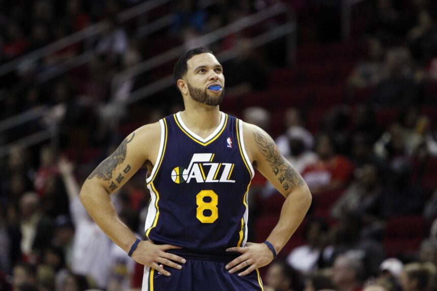 Houston, TX, USA; Utah Jazz guard Deron Williams (8) in action against the Houston Rockets in the first quarter at the Toyota Center. Mandatory Credit: Brett Davis-Imagn Images