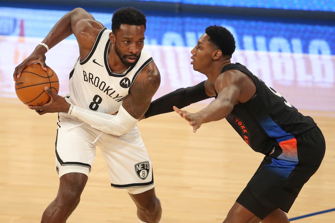 Jan 13, 2021; New York, New York, USA; Brooklyn Nets power forward Jeff Green (8) controls the ball against New York Knicks shooting guard RJ Barrett (9) during the first quarter at Madison Square Garden.
