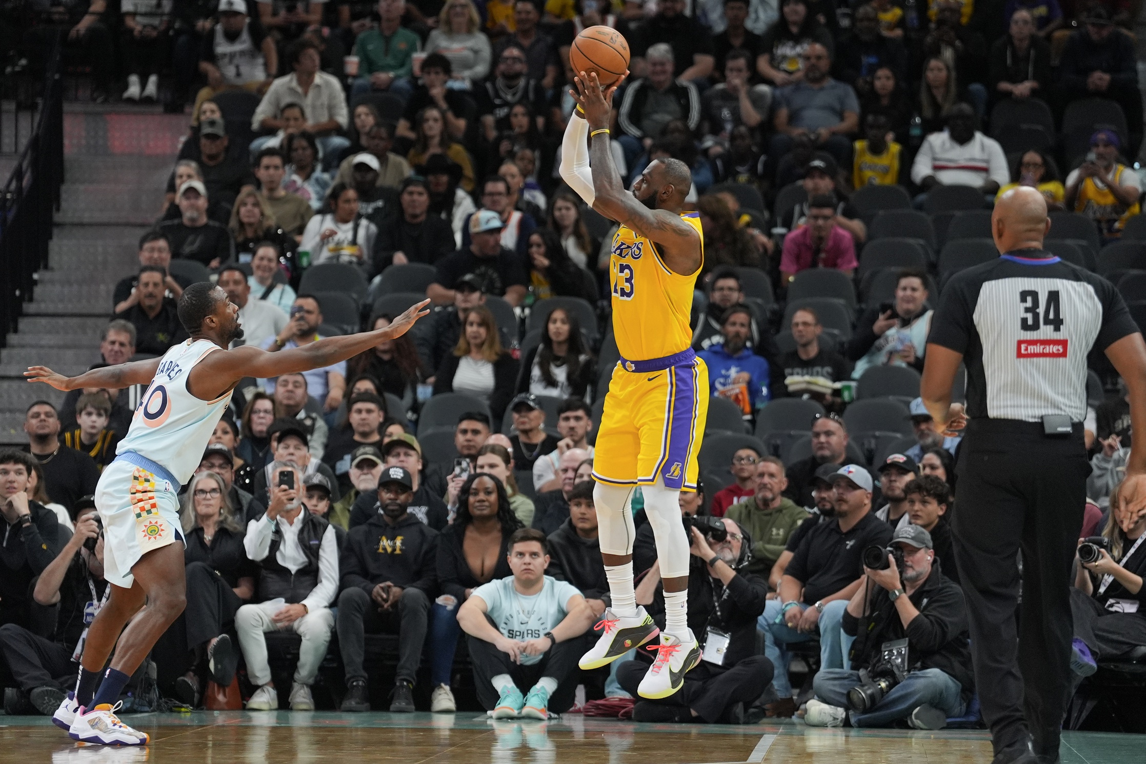 Nov 27, 2024; San Antonio, Texas, USA; Los Angeles Lakers forward LeBron James (23) shoots over San Antonio Spurs forward Harrison Barnes (40) in the first half at Frost Bank Center. Mandatory Credit: Daniel Dunn-Imagn Images  