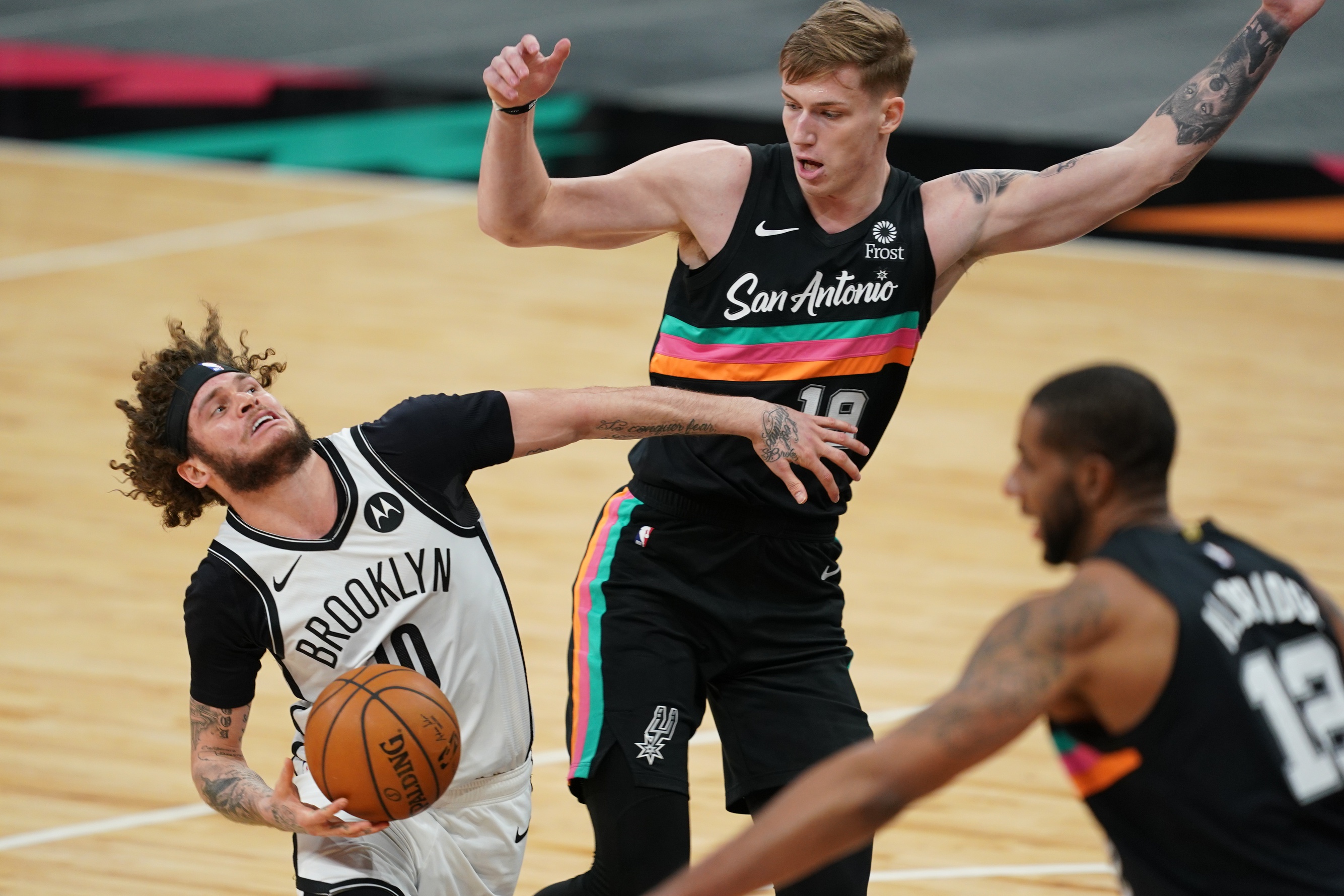 Mar 1, 2021; San Antonio, Texas, USA; Brooklyn Nets guard Tyler Johnson (10) dribbles in against San Antonio Spurs forward Luka Samanic (19) in the second half at the AT&T Center.