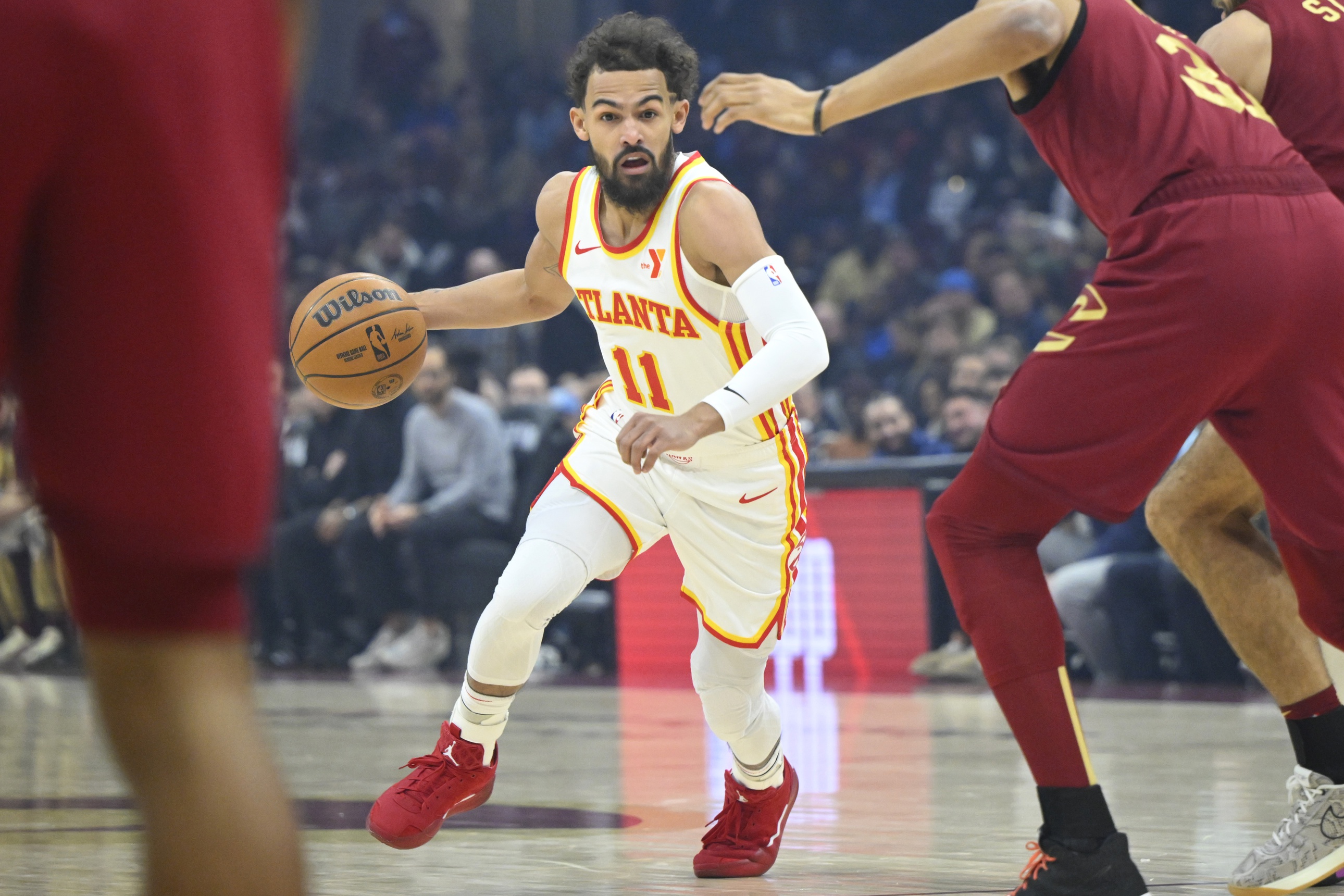  Atlanta Hawks guard Trae Young (11) dribbles against the Cleveland Cavaliers in the first quarter at Rocket Mortgage FieldHouse. Mandatory Credit: David Richard-Imagn Images
